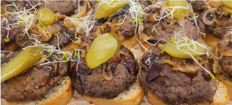 Beef sliders with pickles and onions